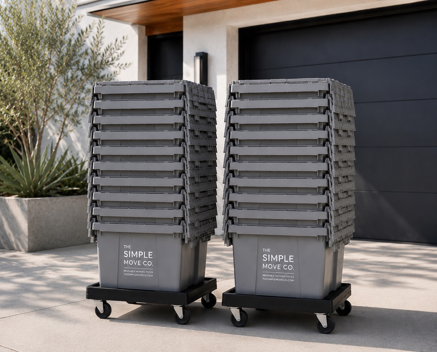 Two stacks of branded reusable moving totes on wheeled dollies, ready for delivery